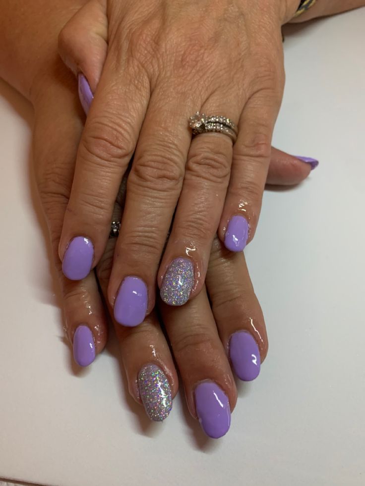 Elegant Lavender Manicure with Glamorous Silver Glitter Accent Nail.