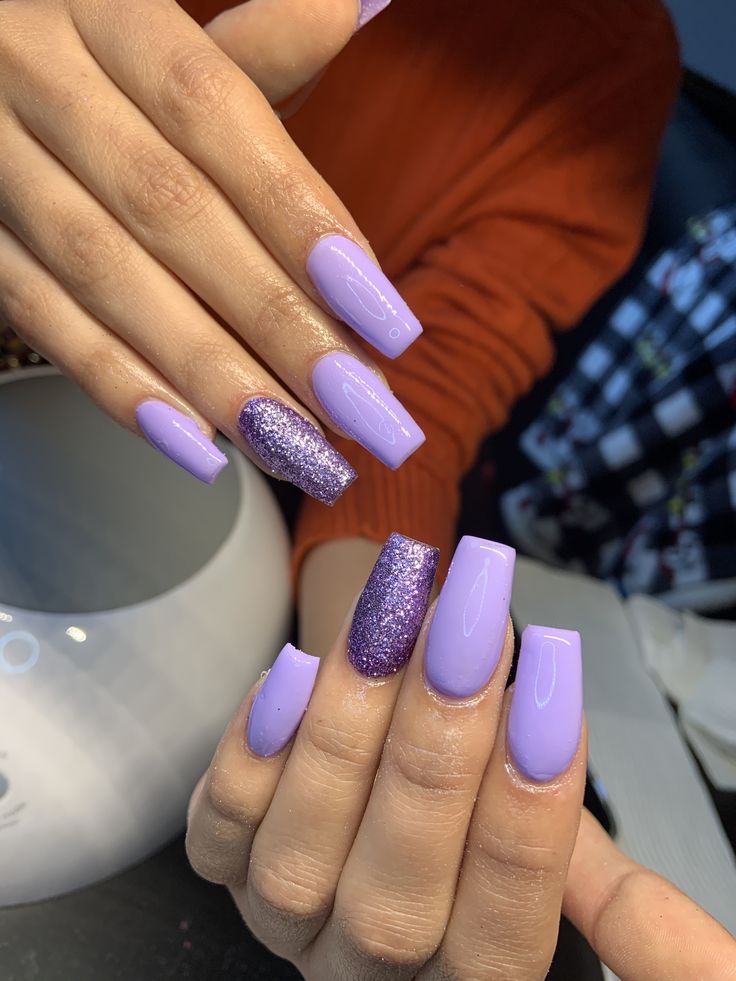 Chic Lavender Nail Design with Glossy and Glitter Finishes.