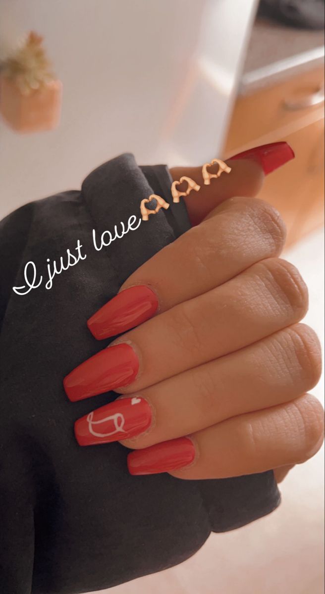 Striking Vibrant Red Nails with Charming Accents and Intricate Designs for Elegance on Any Occasion