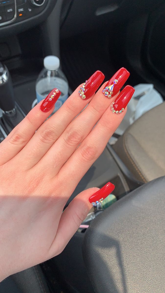 Glamorous Red Almond-Shaped Nail Design with Colorful Rhinestones