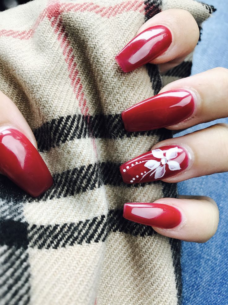 Sophisticated Elegant Red Nail Design with Intricate Floral Accent