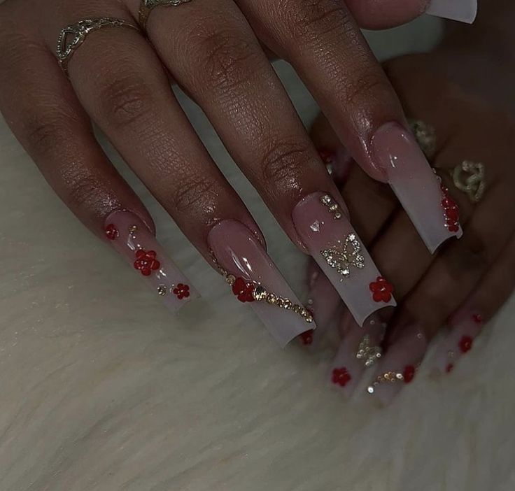 Sophisticated Ombre Nails with Floral Designs and Golden Accents.