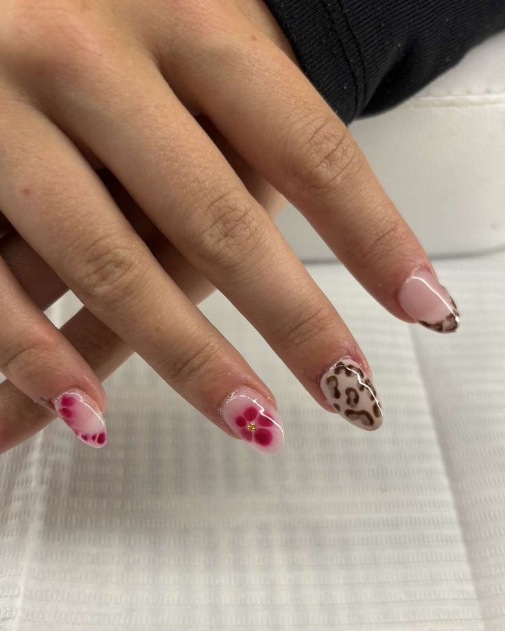 Chic Floral and Animal Print Nail Design: A Playful Blend for Any Occasion.