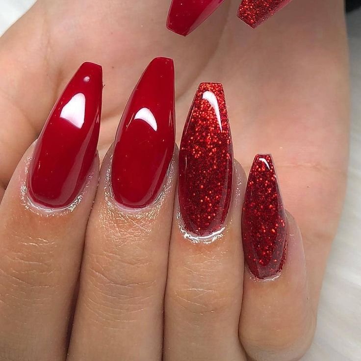 Chic Red Nail Design: Glossy Meets Glitter with Modern Angular Flair.