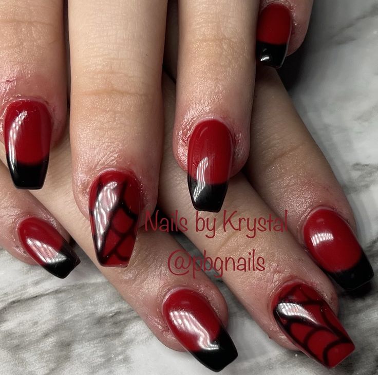 Bold Halloween-Inspired Nail Art: Glossy Red with Black Tips and Spider Web Designs