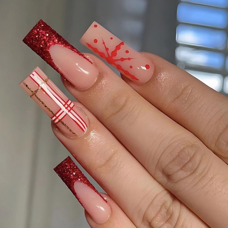 Vibrant Festival-Ready Nail Design: Glossy Nude with Bold Red Glitter and Playful Patterns.