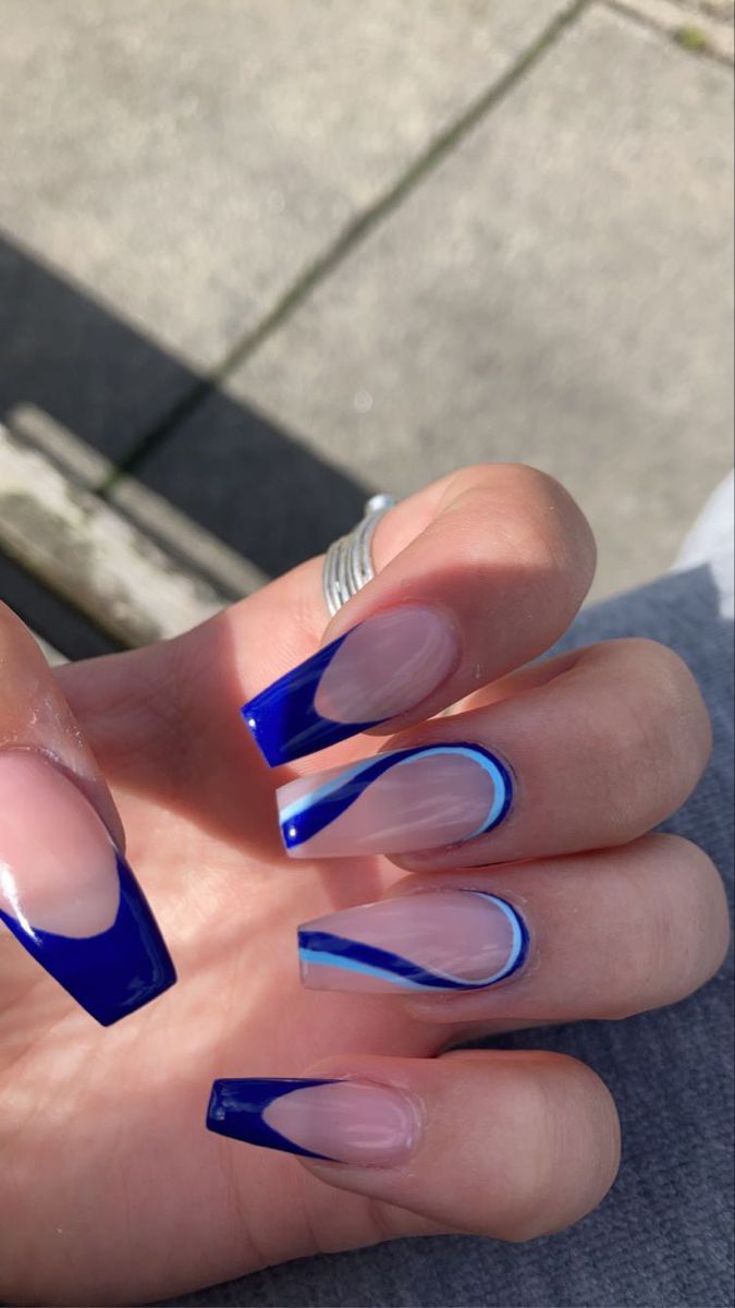 Elegant Blue and Nude Nail Design with Geometric Accents.