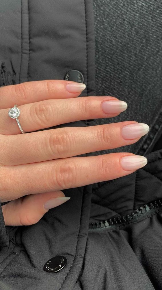 Chic Almond-Shaped Nails with Subtle Ombre from Nude to Translucent Tip.