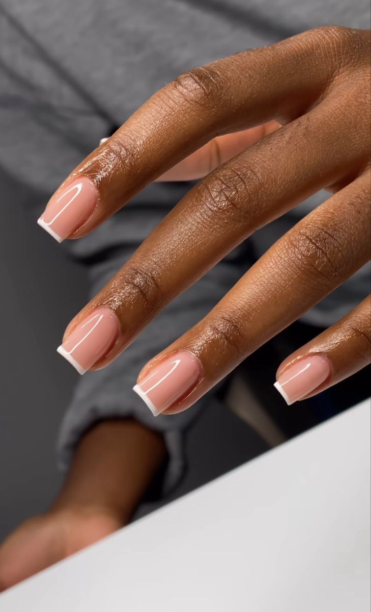 Timeless Elegance: The Perfect French Manicure with Soft Nude Base and Clean White Tips.