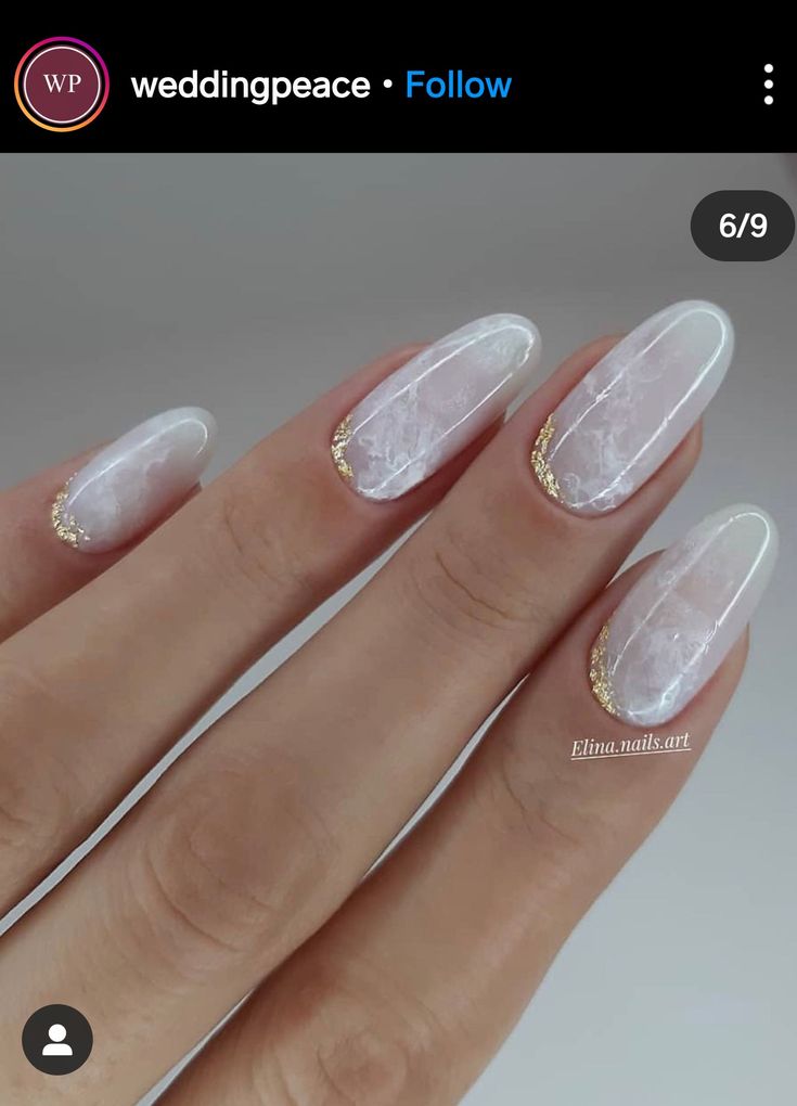 Pearlescent Marble Nail Design with Glamorous Gold Accents