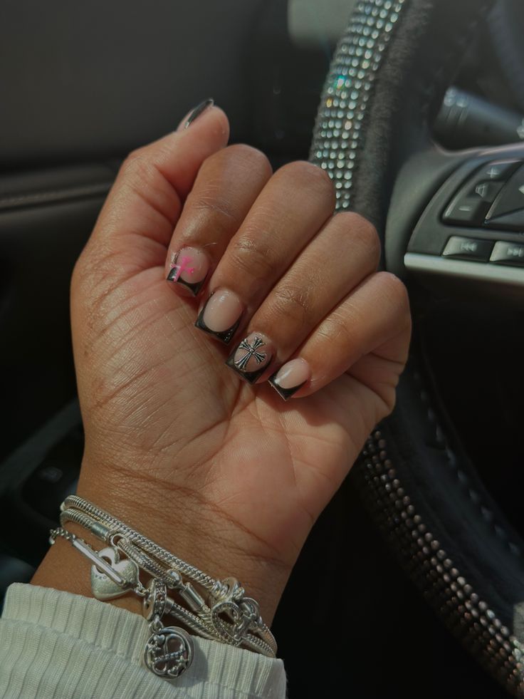 Chic and Playful Nail Design with Neutral and Pastel Shades and Intricate Patterns.