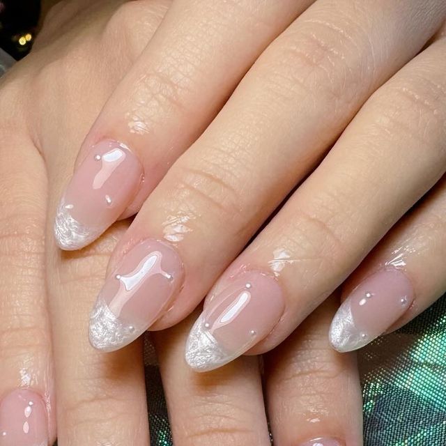 Sophisticated Soft Pink and Shimmering White Nail Design for Timeless Elegance.