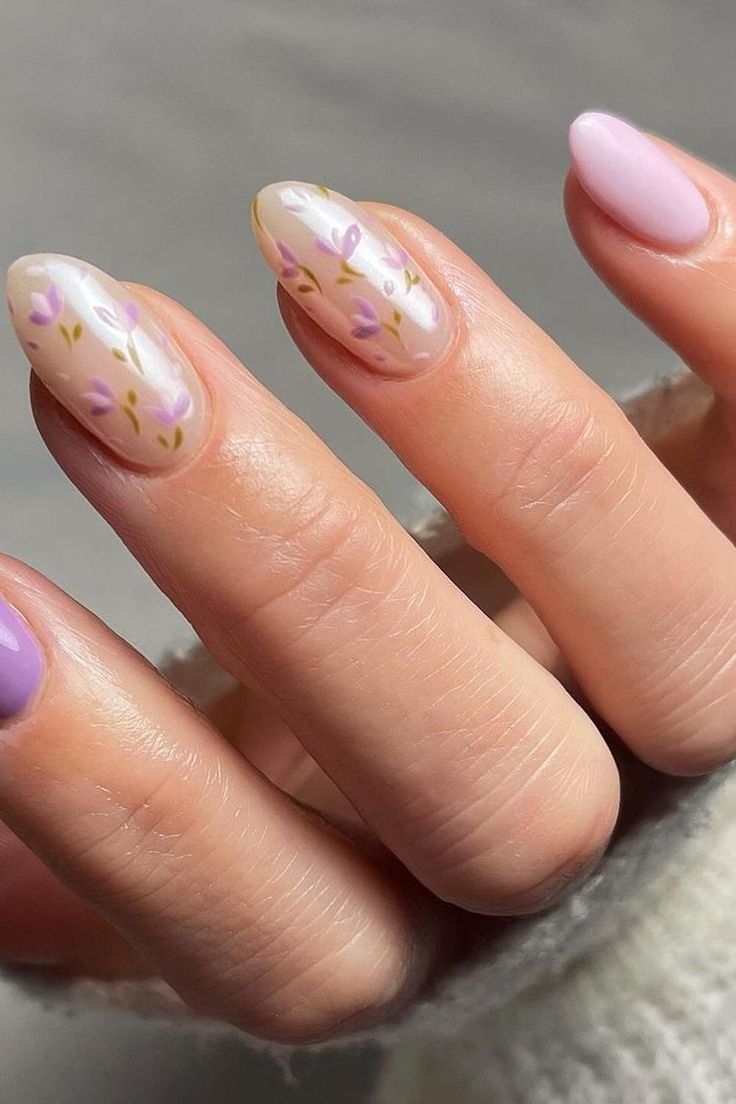 Delicate Lavender Floral Nail Design: A Sophisticated Manicure with Elegant Accents and Pointed Shape.