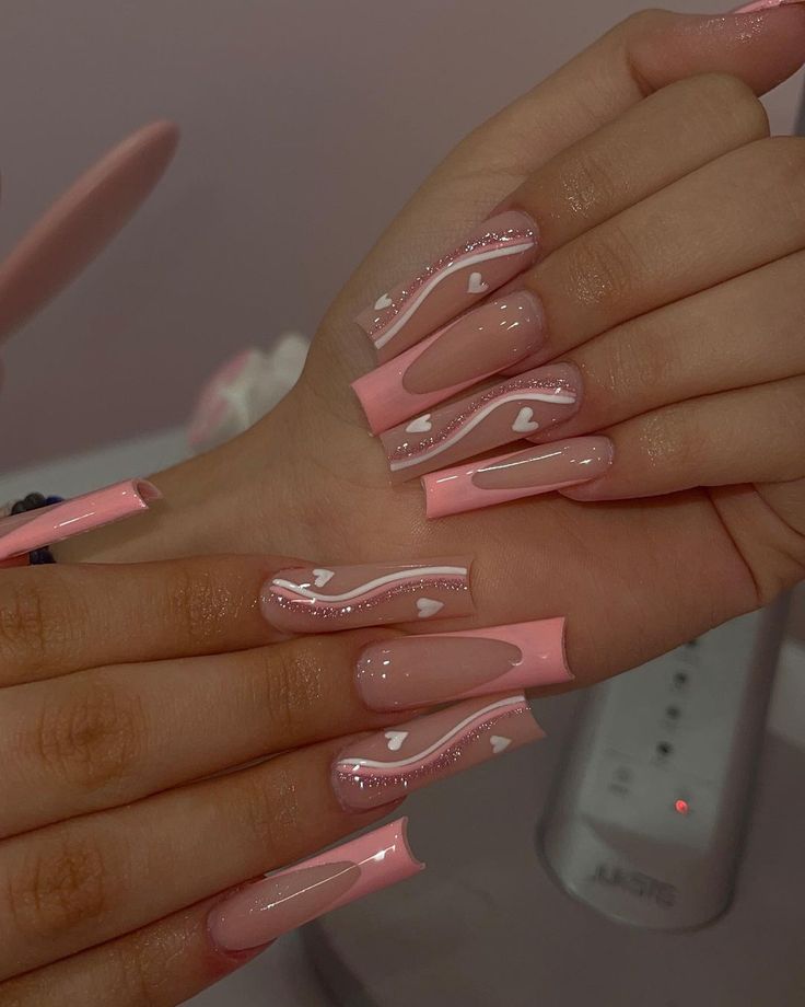 Chic Pink Nail Design with Glossy Finish and Playful Heart Accents