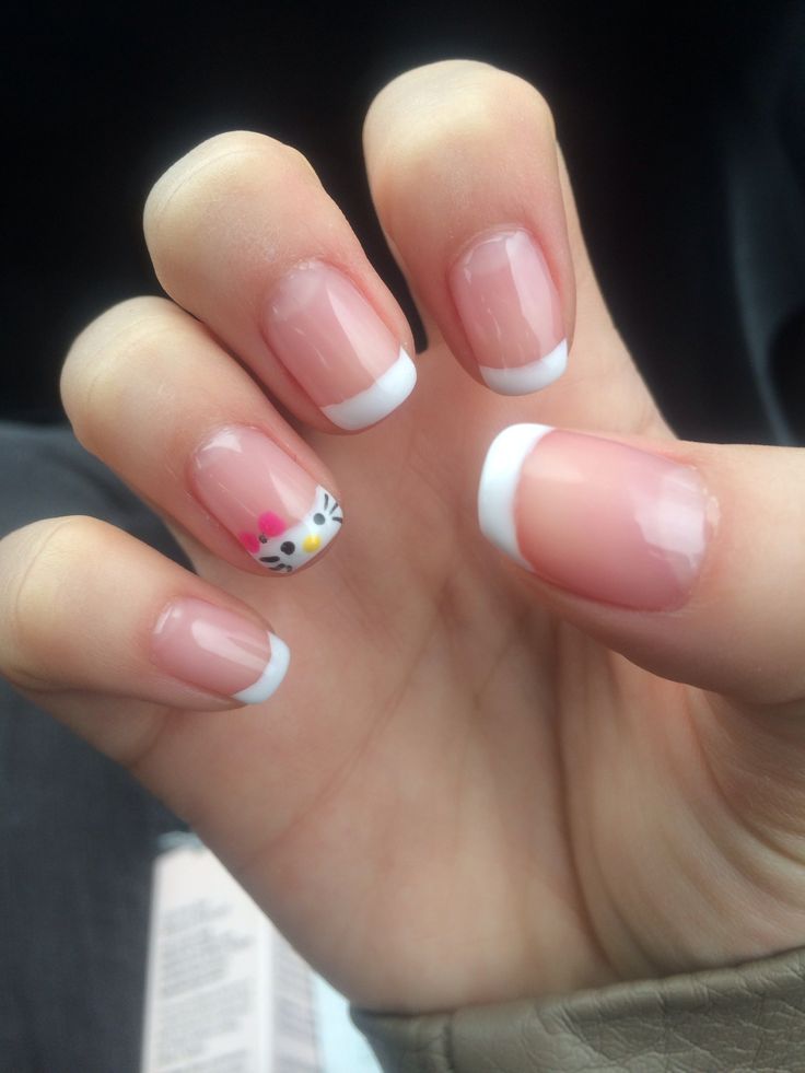 Sophisticated French Tip Nail Design with Playful Artistic Detail