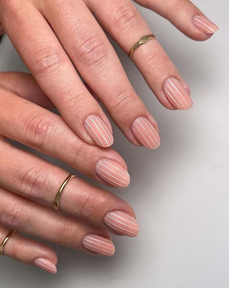 Chic Minimalist Nail Design with Nude Base and Delicate White Stripes