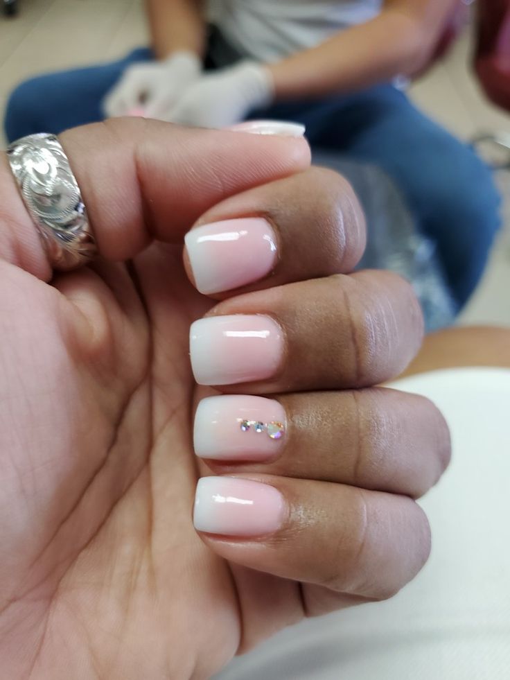 Sophisticated Ombre Nail Design with Delicate Gem Accent.