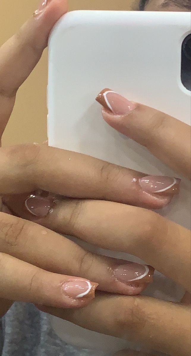 Sophisticated Ombre Nail Design with Soft Nude Base and Delicate White Accents