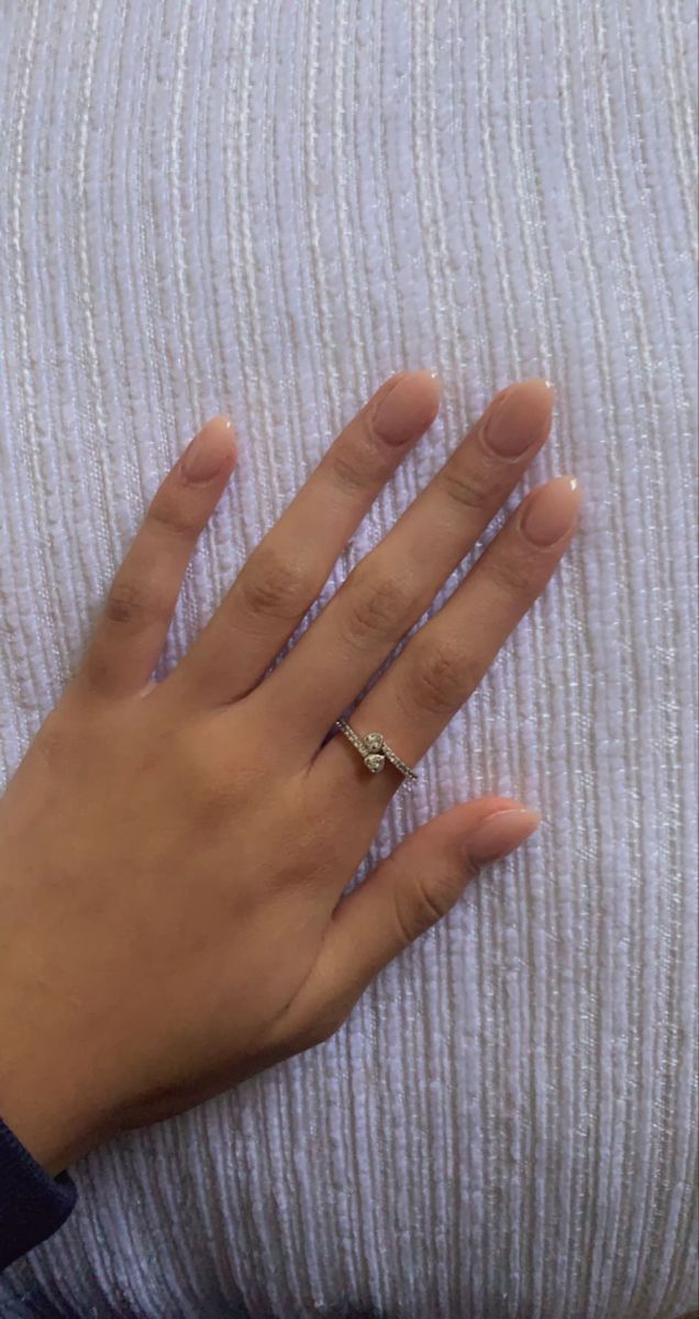 Sophisticated Elegant Nude Nail Design with Subtle Sheen and Graceful Accents.