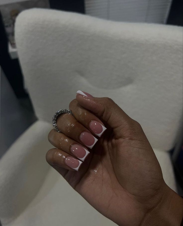 Elegant Modern French Tip Manicure with Soft Pink and Chic White Accents.