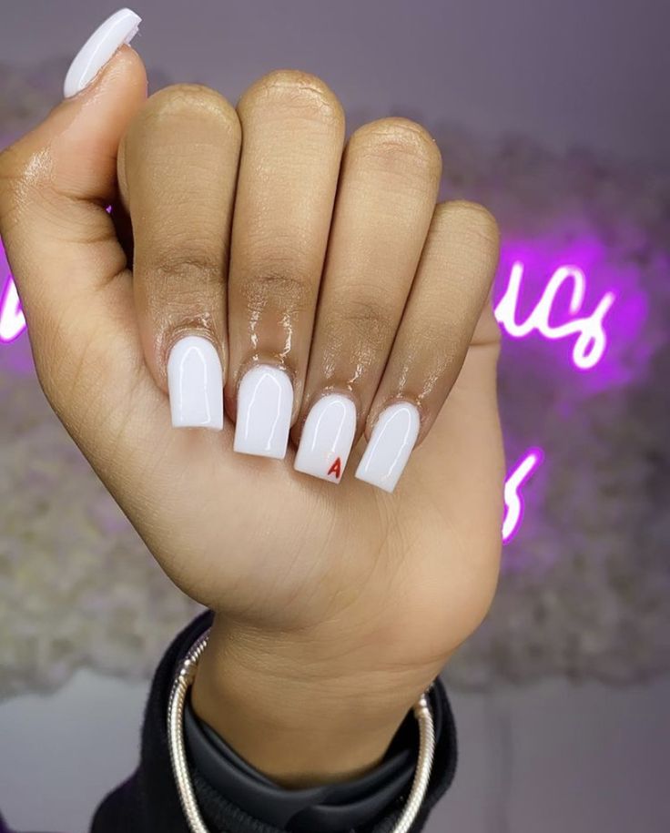 Chic White Nails with Square Tips and a Bold Red Accent.