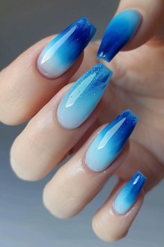 Elegant Ombre Nail Design with Blue Gradient and Sparkling Accents