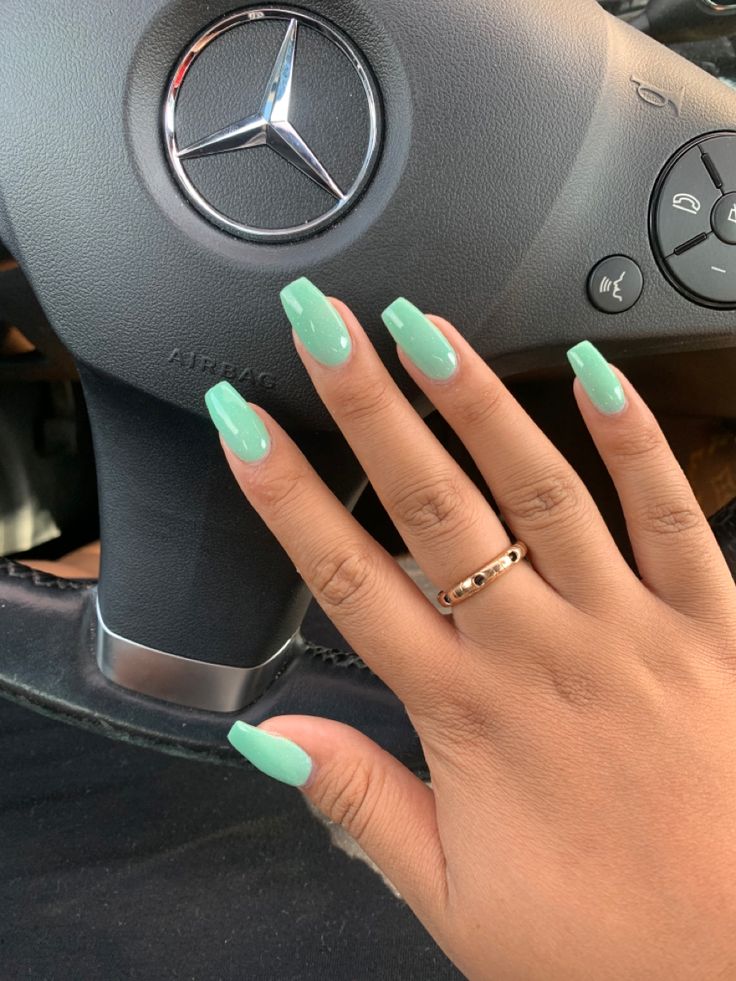 Fresh and Elegant Mint Green Nail Design with Long Squared Shape.