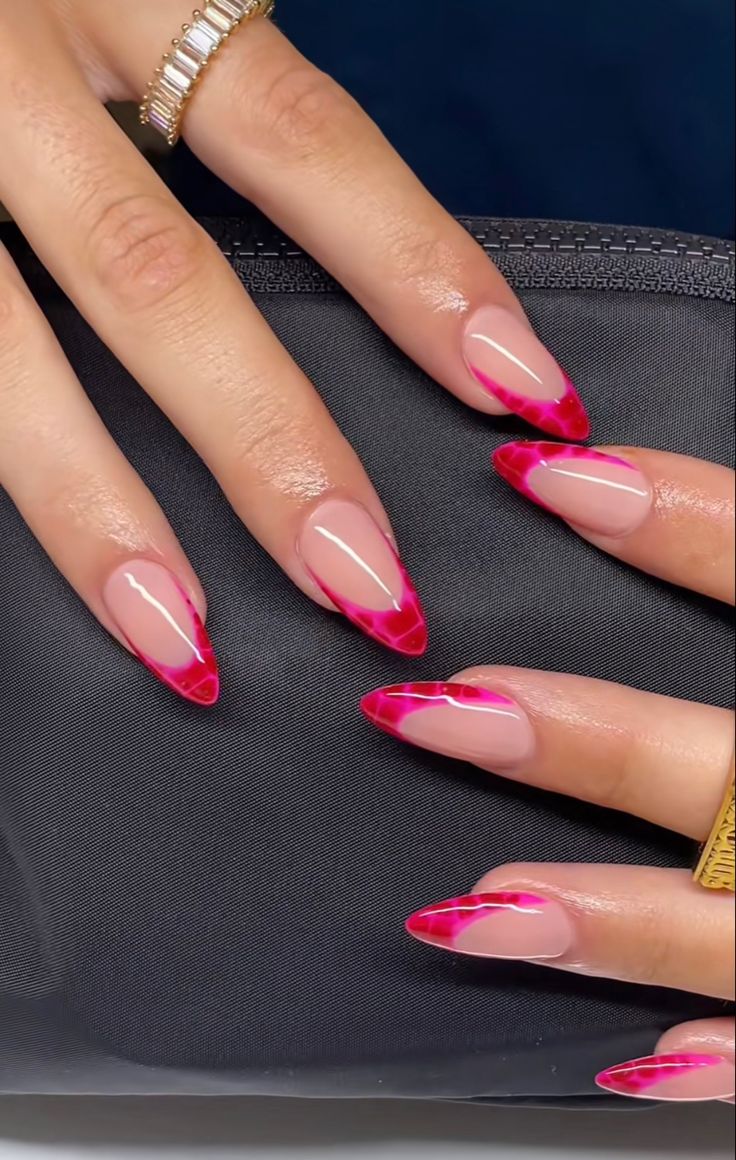 Chic Almond-Shaped Nail Design with Glossy Clear Base and Bold Pink Tips.