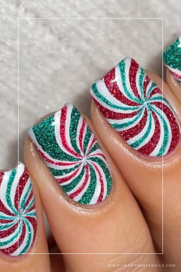 Vibrant Christmas Nail Design with Bold Swirls and Candy Cane Effect.