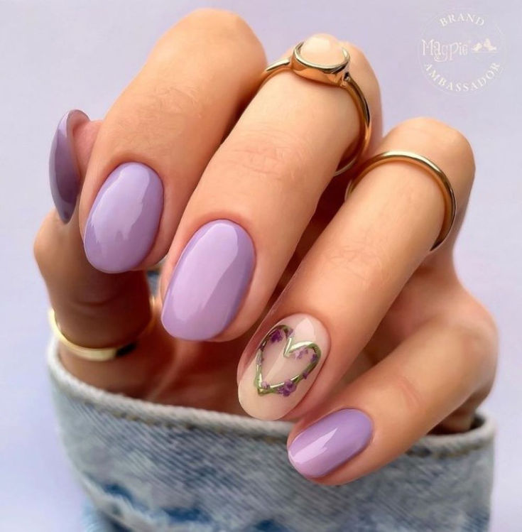 Elegant Lavender Nail Design with Glossy Finish and Heart Accent.