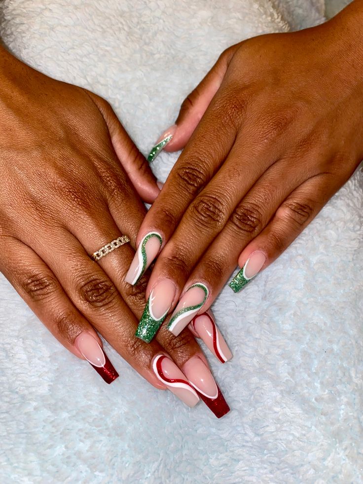 Joyful Holiday Nail Design: Soft Nude, Red, Green with Chevron and Glitter Accents