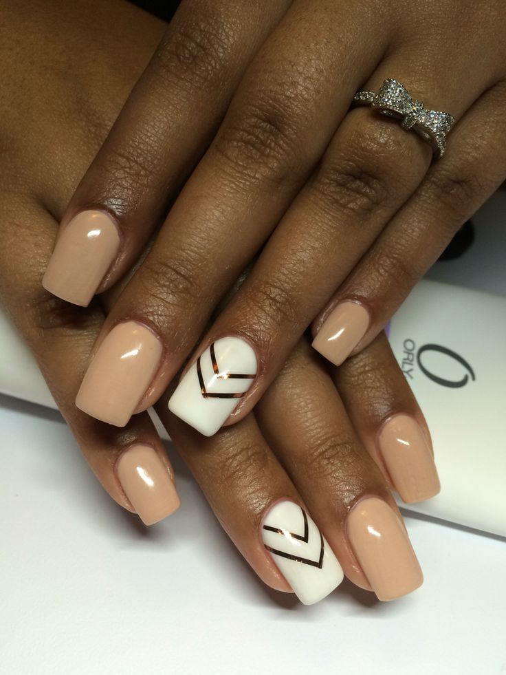 Chic Manicure: Elegant Nude Base with Pristine White Accent and Metallic Lines.