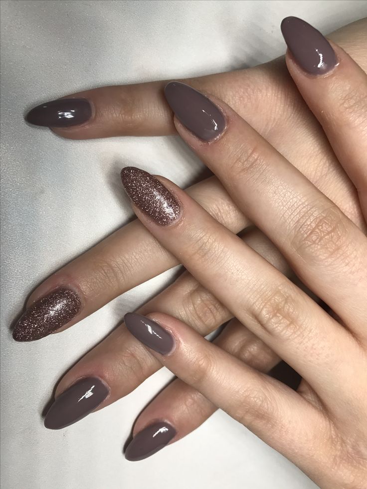 Sophisticated Nail Design Blending Rich Tones with Playful Sparkle.