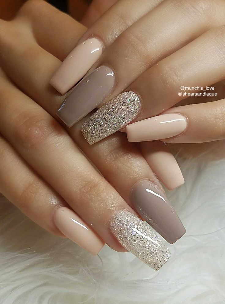 Chic Elegant Nude Nail Design with Glossy Finish and Glitter Accent.