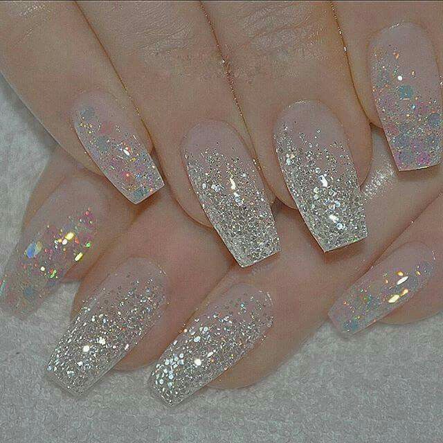 Stunning Glittery Ombre Nails: Translucent Tips to Holographic Accents Perfect for Any Occasion.