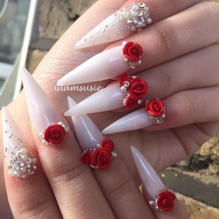 Sophisticated Stiletto Nails: White Base Enhanced with Jewels and Red Roses.