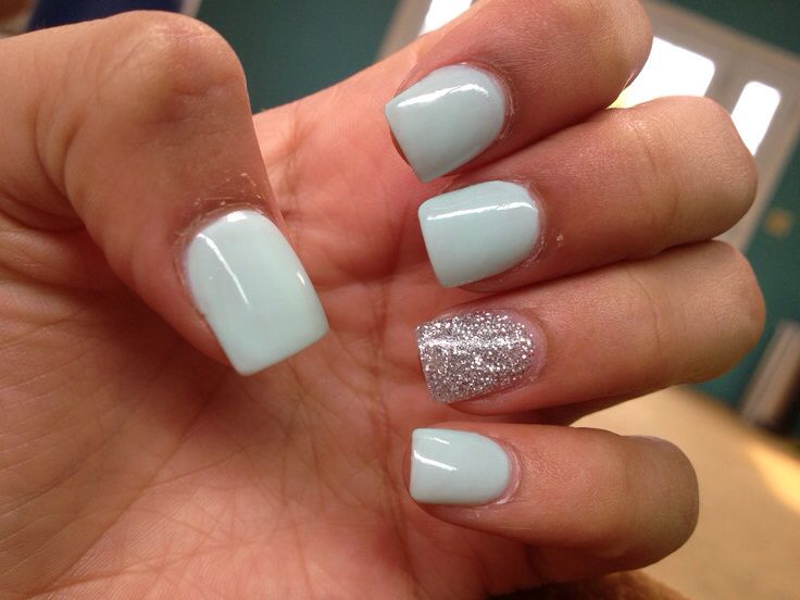 Sophisticated Mint Green Nails with Glamorous Silver Accent for All Occasions.