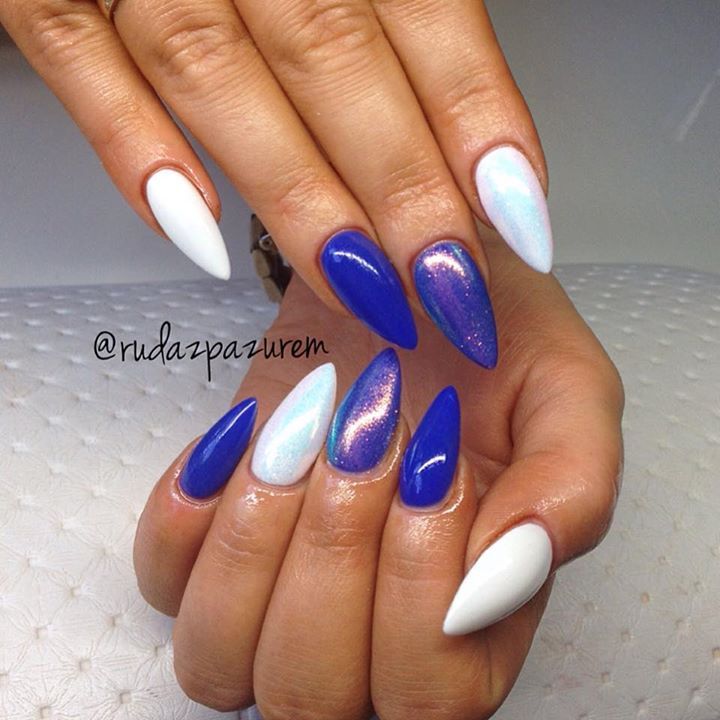 Vibrant Blue and Crisp White Nail Design with Holographic Accent: A Bold Fashion Statement.