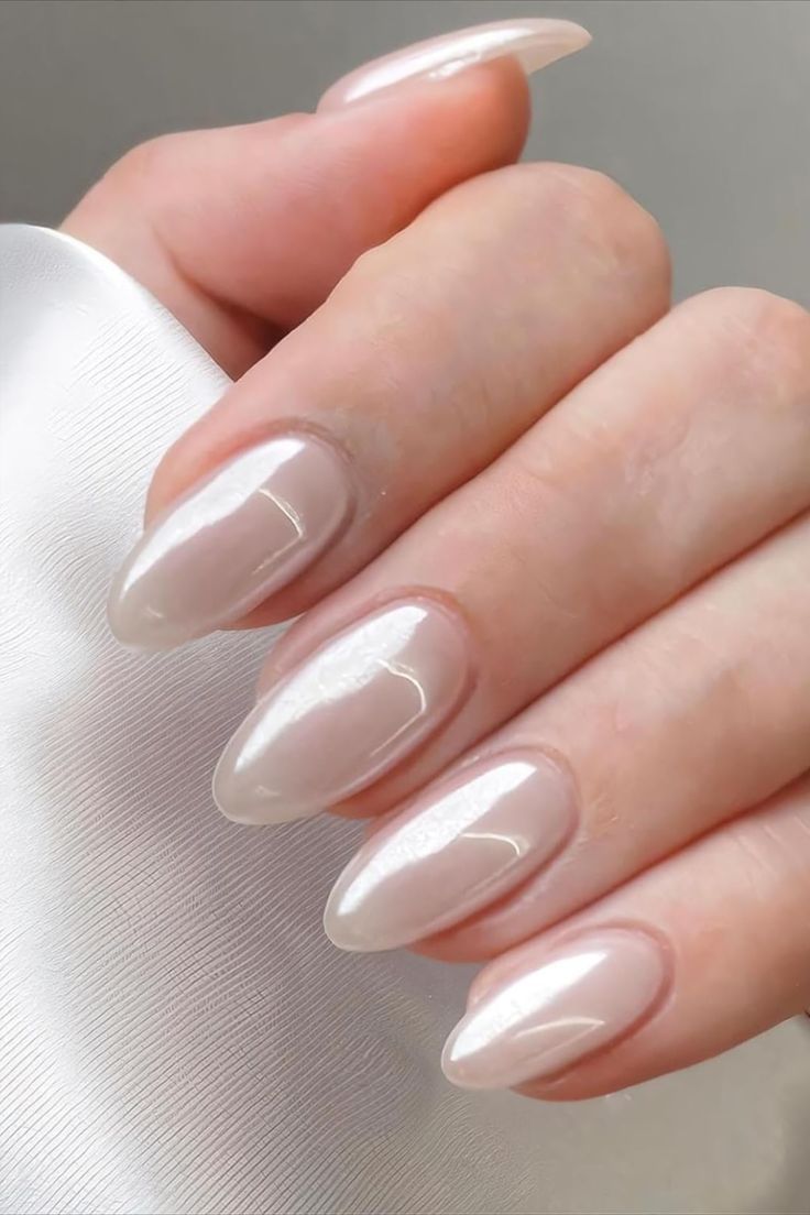 Sophisticated Glossy Nude Almond Nails: A Timeless Blend of Subtlety and Style.