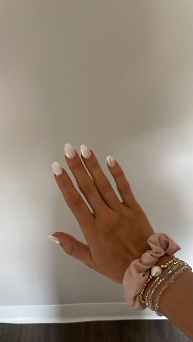 Chic Almond-Shaped White Nails: A Minimalist and Sophisticated Look.