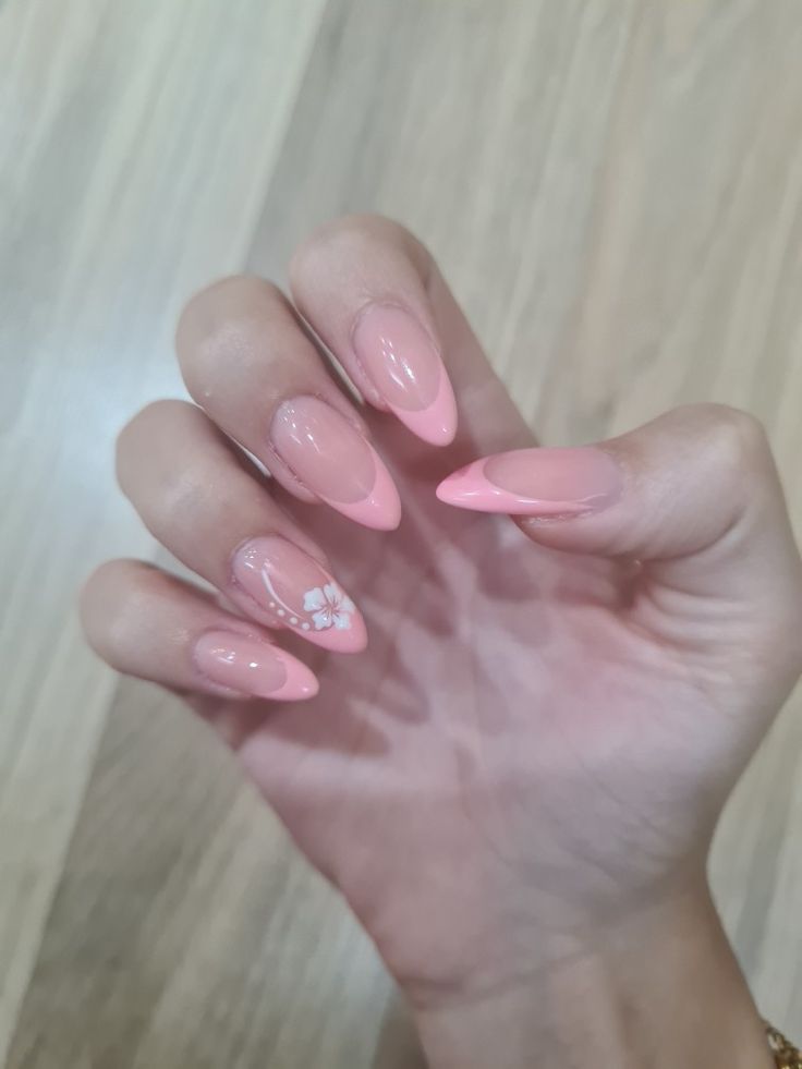 Chic Almond-Shaped Nails with Soft Pink Gradient and Floral Accent