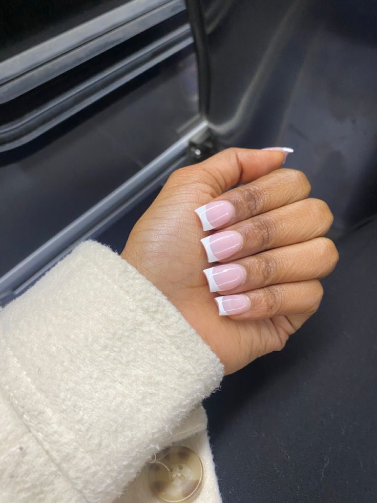 Timeless Chic: Soft Pink Base with White Tips for an Elegant French Manicure.