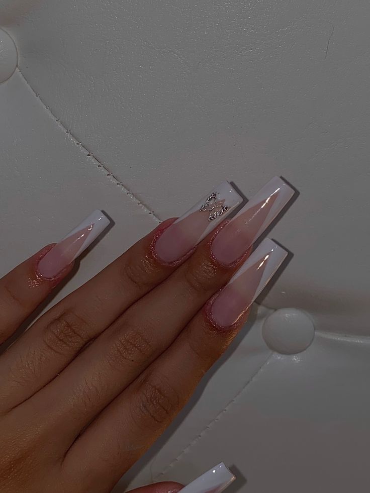 Chic Almond-Shaped Nails with Soft Pink to White Gradient and Glitter Accents.