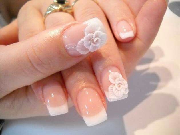 Sophisticated French Tip Nails with Intricate Floral Designs for Timeless Elegance.