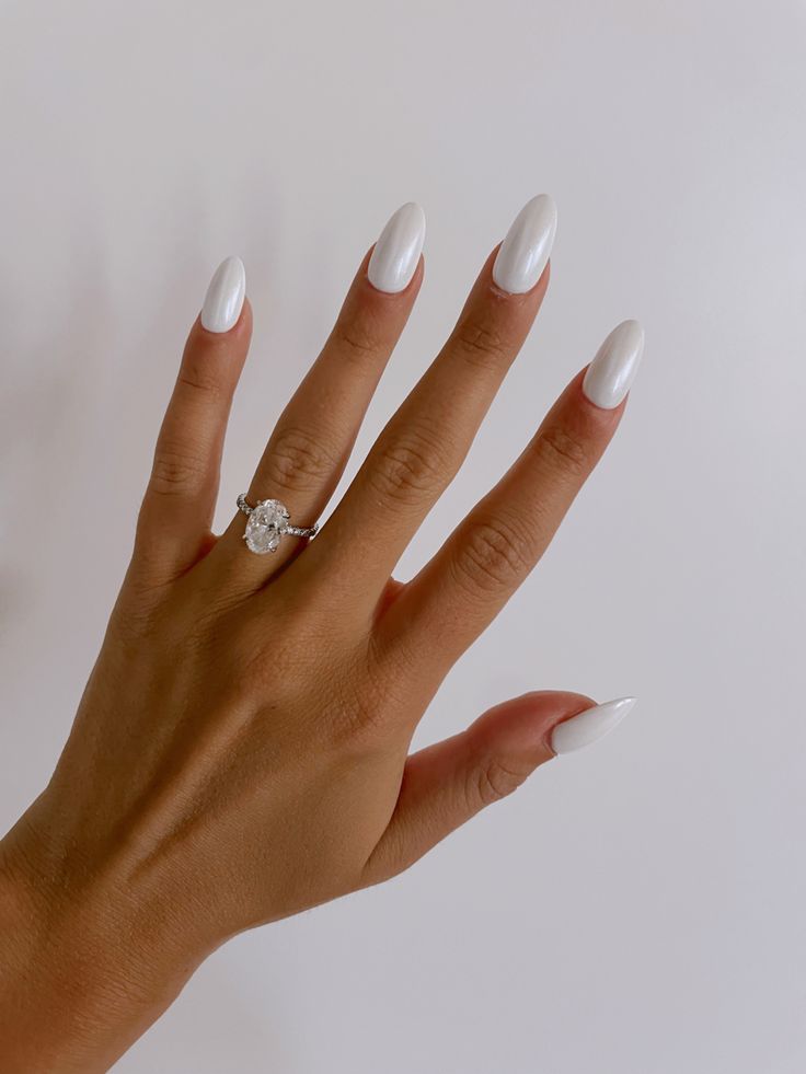 Elegant Almond-Shaped White Nails: A Timeless and Sophisticated Choice for Any Occasion.