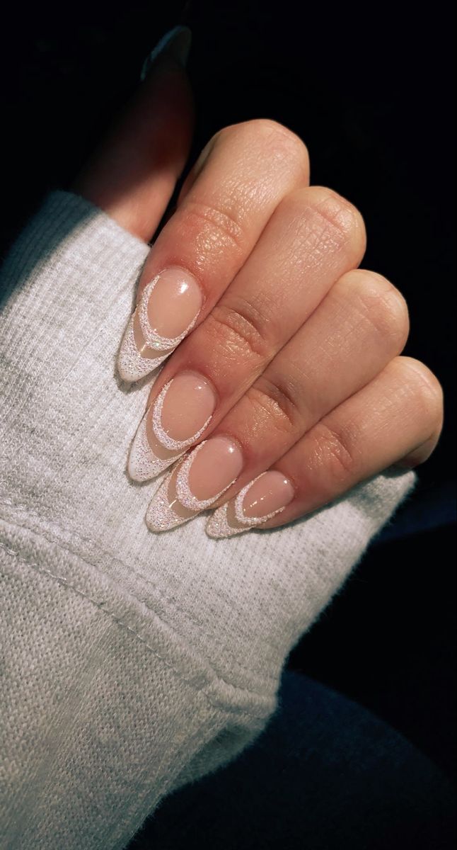 Chic Almond-Shaped Nails with Nude Base and Delicate White Tips for Understated Glamour.