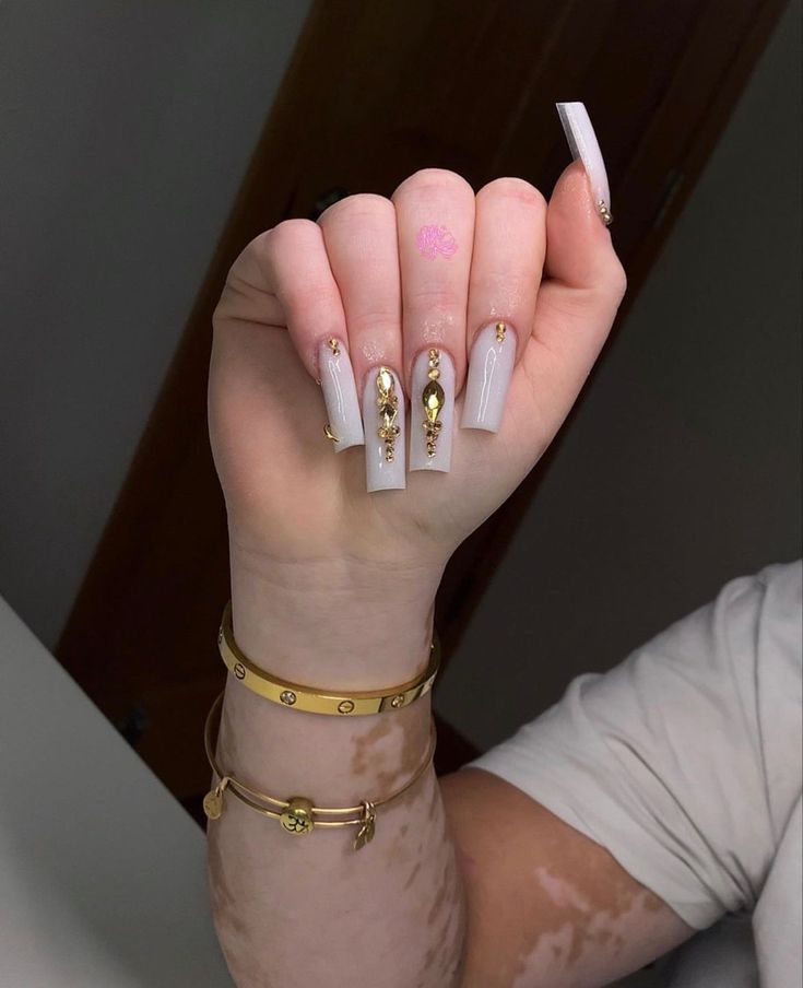 Elegant Glossy White Coffin Nails with Gold Embellishments and Gemstones