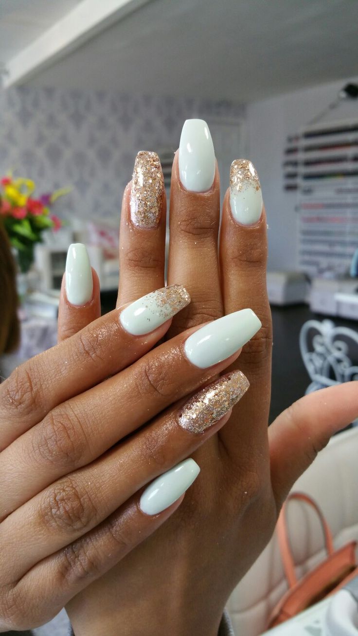 Chic Mint Green Coffin Nails with Gold Glitter Accents for Modern Elegance.