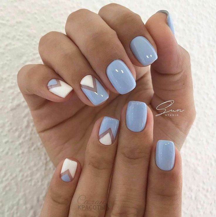 Stylish Geometric Nail Design: Soft Blue Base with Modern White Accents