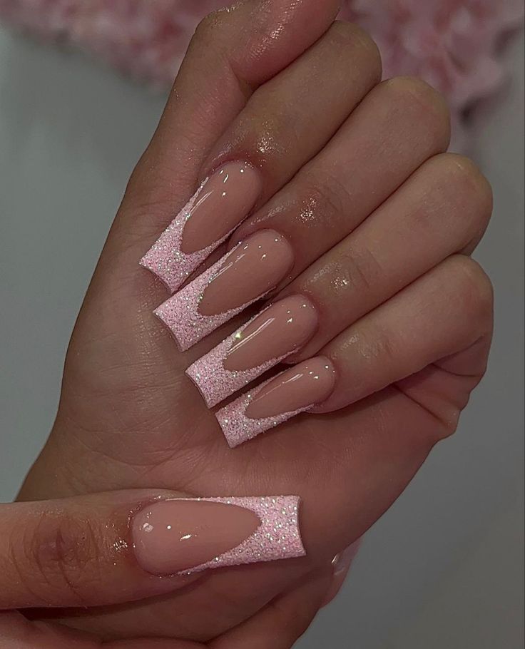 Chic Elegant Nail Design with Soft Pink Base and Glossy Glitter Accents